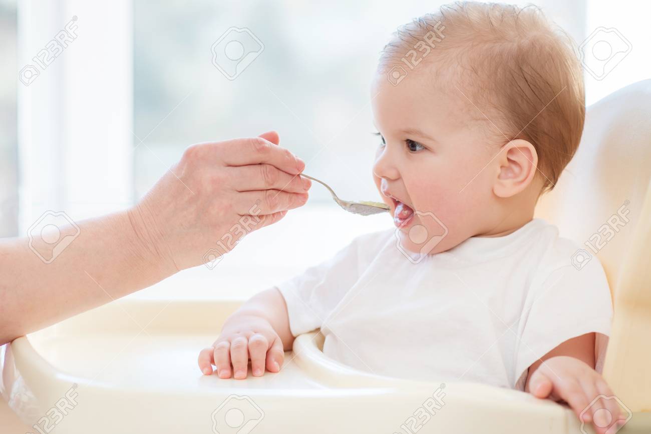 baby eating porridge
