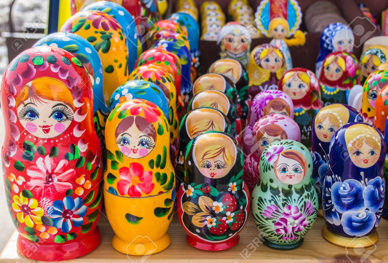 Rows of the Russian puzzle nesting dolls in various colours - 37874250 Rows of the Russian puzzle nesting dolls in various colours - 37874250