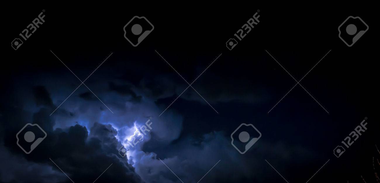 Electric Lightning Bolt Inside A Thunderhead Of Dark Blue Clouds Stock Photo Picture And Royalty Free Image Image
