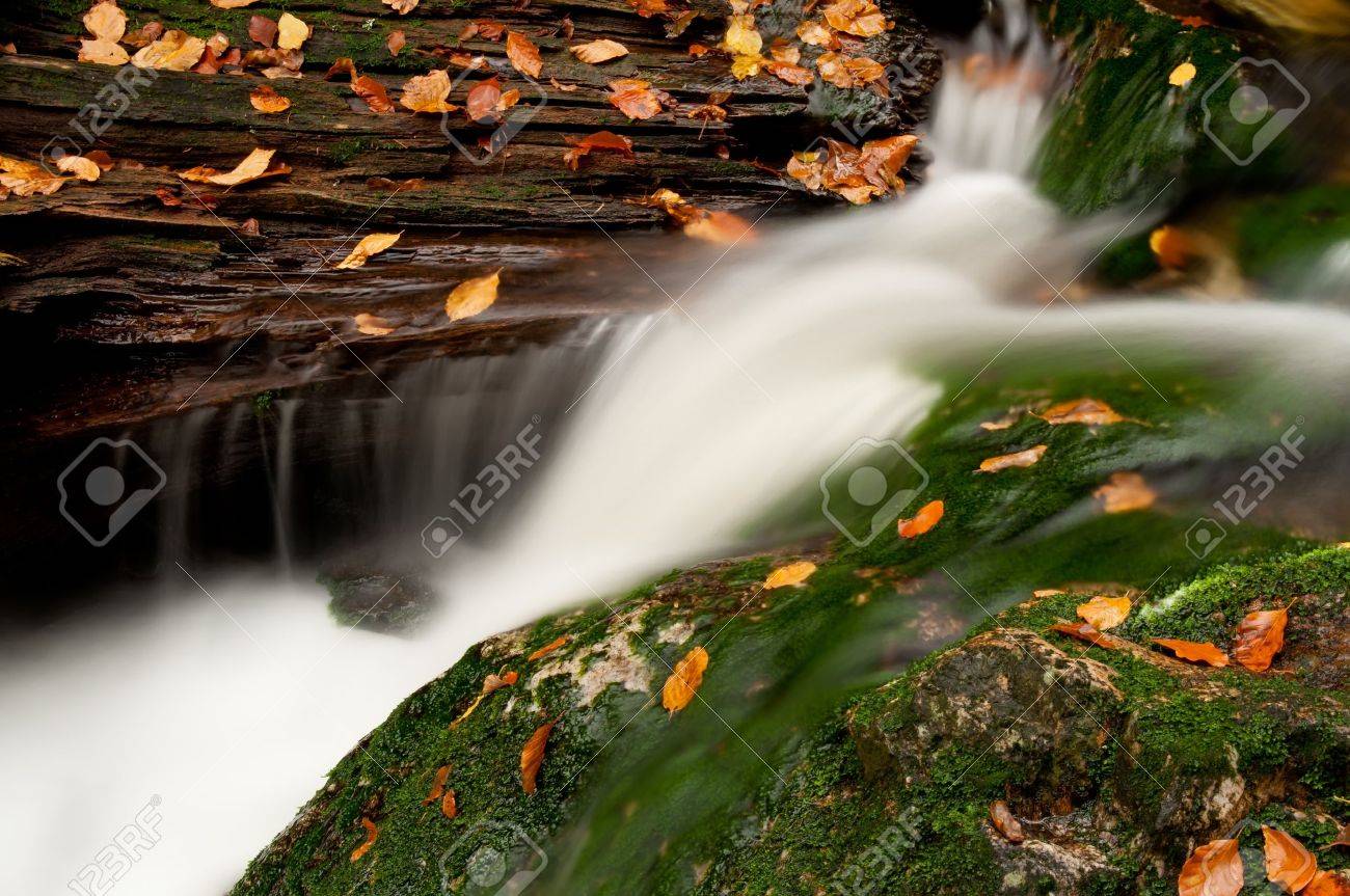 Detailed view of a beautiful waterfall during the autumn time. - 11563300 Detailed view of a beautiful waterfall during the autumn time. - 11563300