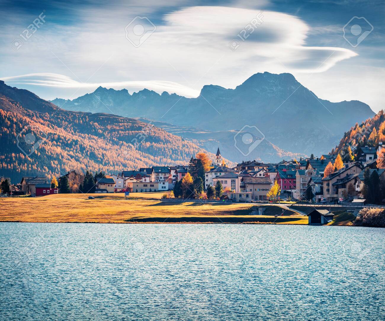 Stunning autumn cityscape of Silvaplana town. Splendid morning view of Lake Champfer, Upper Engadine in the Swiss canton of the Grisons, Switzerland, Europe. Traveling concept background. - 140764661 Stunning autumn cityscape of Silvaplana town. Splendid morning view of Lake Champfer, Upper Engadine in the Swiss canton of the Grisons, Switzerland, Europe. Traveling concept background. - 140764661