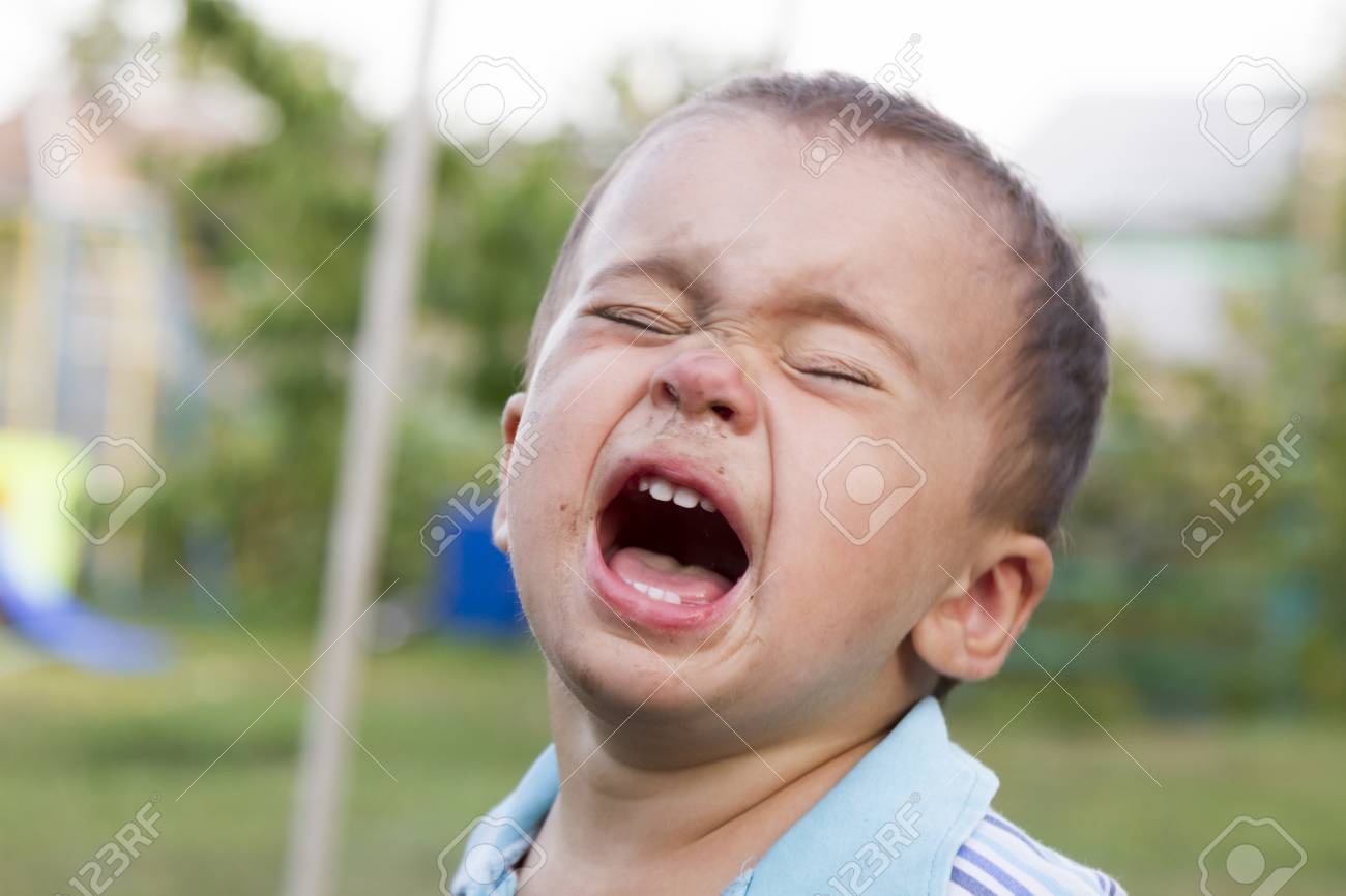 angry sad and unhappy baby child shouting and crying problem