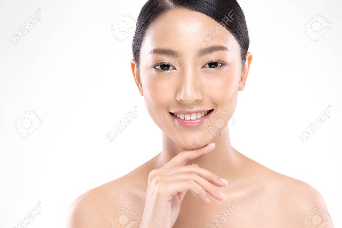 Beautiful Young Asian Woman Looking While Touching Chin feeling so happy and cheerful with healthy Clean and Fresh skin,isolated on white background,Beauty Cosmetology Concept - 137860450 Beautiful Young Asian Woman Looking While Touching Chin feeling so happy and cheerful with healthy Clean and Fresh skin,isolated on white background,Beauty Cosmetology Concept - 137860450