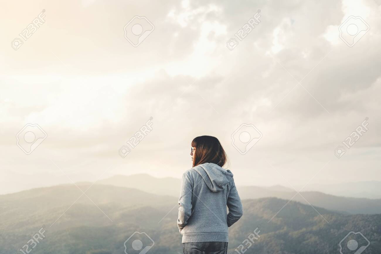 Happy Woman Enjoying Life In Field At Sunset In Mountains Stock Photo,  Picture and Royalty Free Image. Image 119496928.