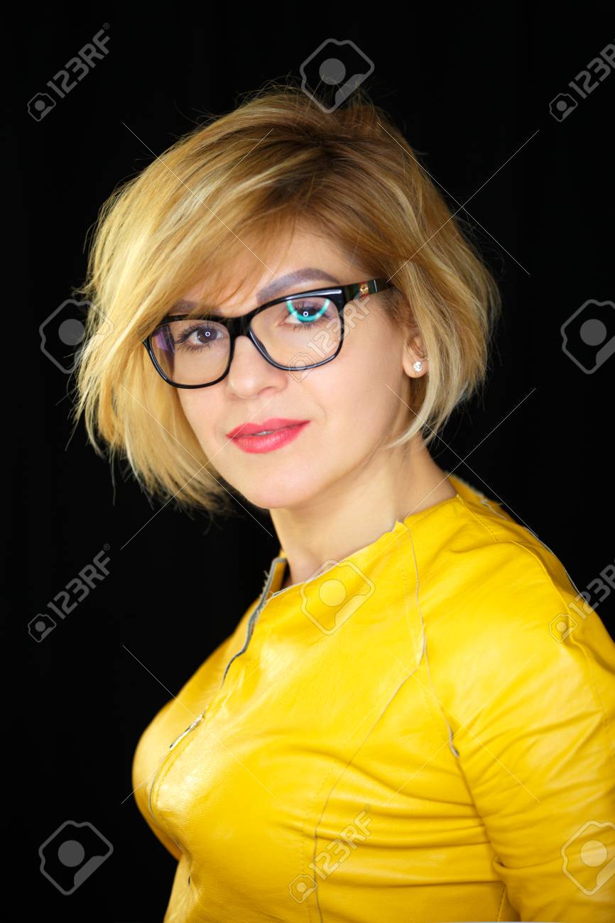 Portrait Of Beautiful Model With Short Blonde Hair On Black