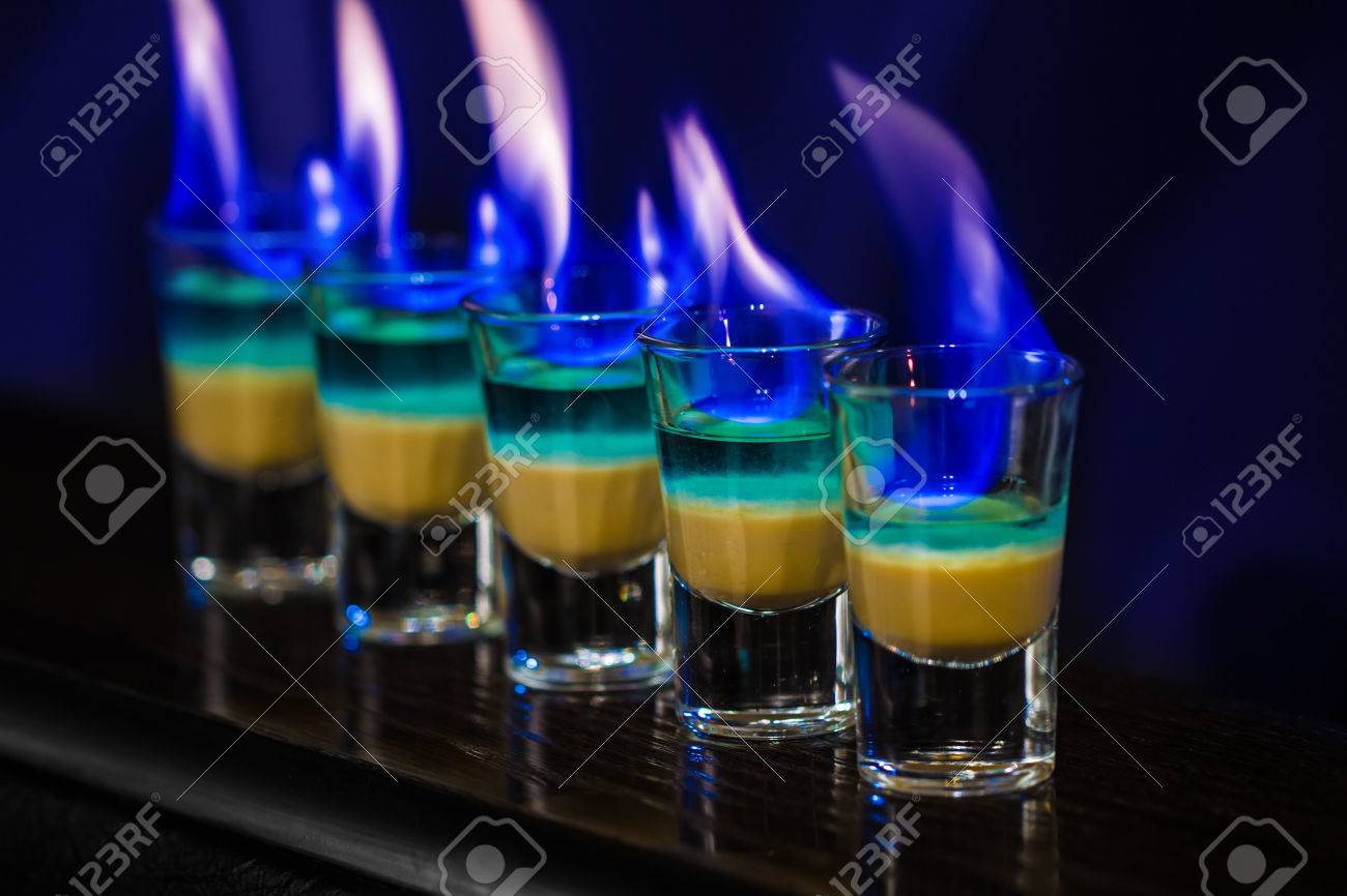 25347171-Barman-make-alcoholic-shots-with-absent-in-nightclub-Stock-Photo.jpg