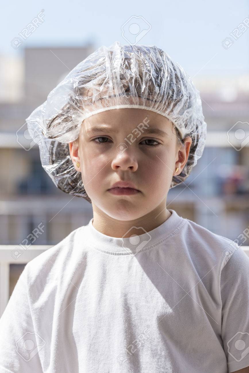 Little girl in a bathing cap following a antilice treatment - 39639963 Little girl in a bathing cap following a antilice treatment - 39639963