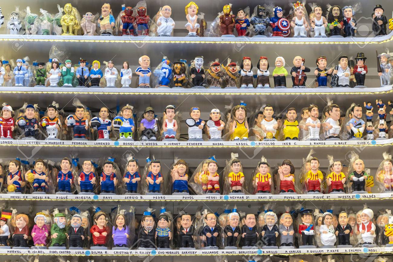 Barcelona, Spain - December 19, 2014: Santa Llucia Fair Is A Christmas  Market Items Where A Significant Figure Is The Caganer, Typical Figure  Catalan Manger. This Figure Represents Someone Defecating, Now You, image size:1300x867