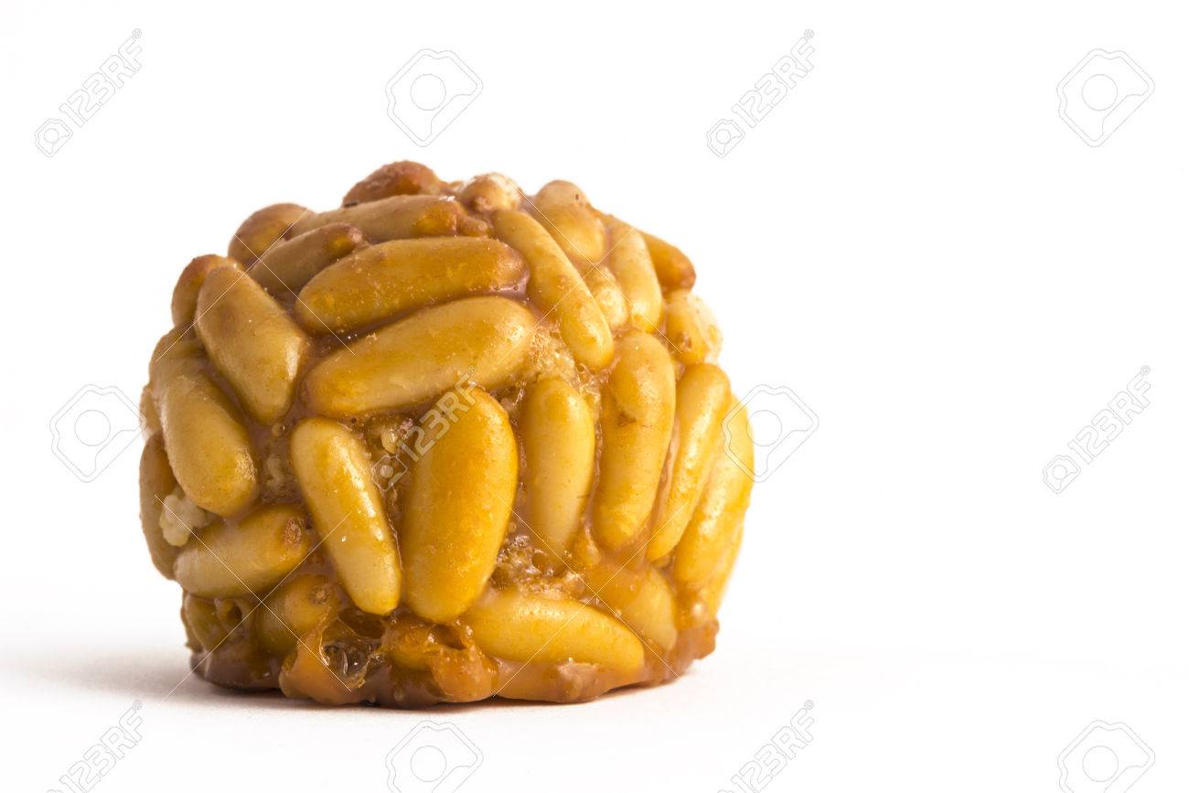 Panellet pine nuts isolated on white. Panellet are traditional desserts of All Saints holiday, known as Castanyada in Catalonia, Spain - 47275963 Panellet pine nuts isolated on white. Panellet are traditional desserts of All Saints holiday, known as Castanyada in Catalonia, Spain - 47275963