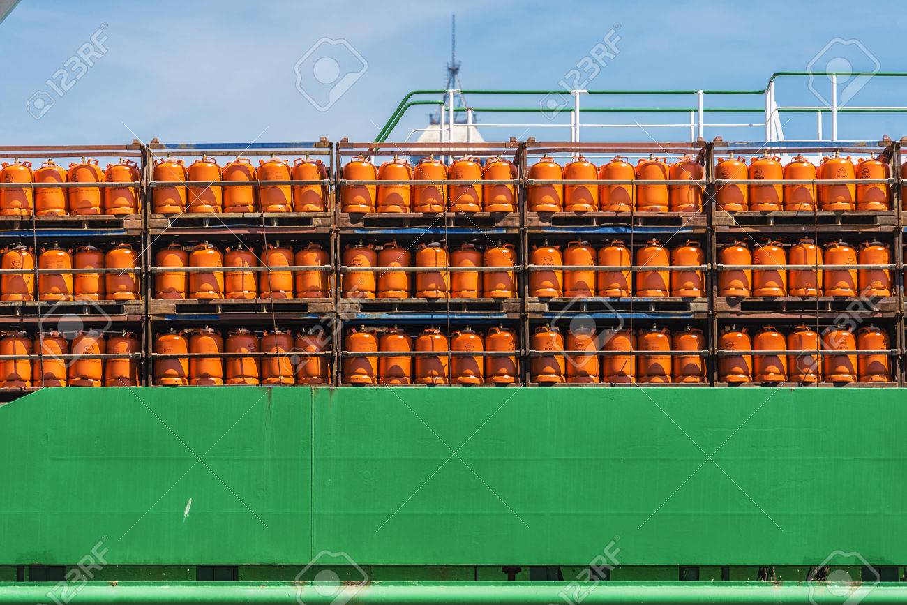 Barcelona, Spain - May 2, 2015: Butane cylinders Repsol brand stored in a boat in the port of Barcelona - 52322177 Barcelona, Spain - May 2, 2015: Butane cylinders Repsol brand stored in a boat in the port of Barcelona - 52322177