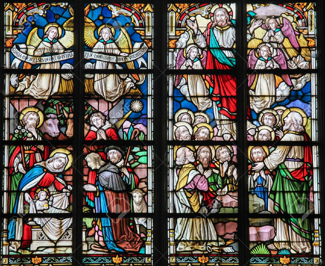 STABROEK, BELGIUM - JUNE 27, 2015: Stained glass window depicting a Nativity Scene at Christmas and the Resurrected Christ in the Church of Stabroek, Belgium. - 42130565 STABROEK, BELGIUM - JUNE 27, 2015: Stained glass window depicting a Nativity Scene at Christmas and the Resurrected Christ in the Church of Stabroek, Belgium. - 42130565