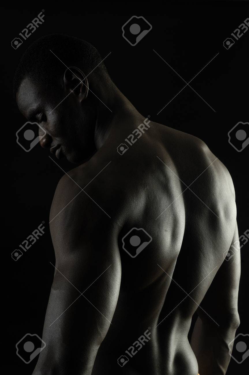 Back Of A Naked African Boy, Black Background Stock Photo, Picture and  Royalty Free Image. Image 47219552.