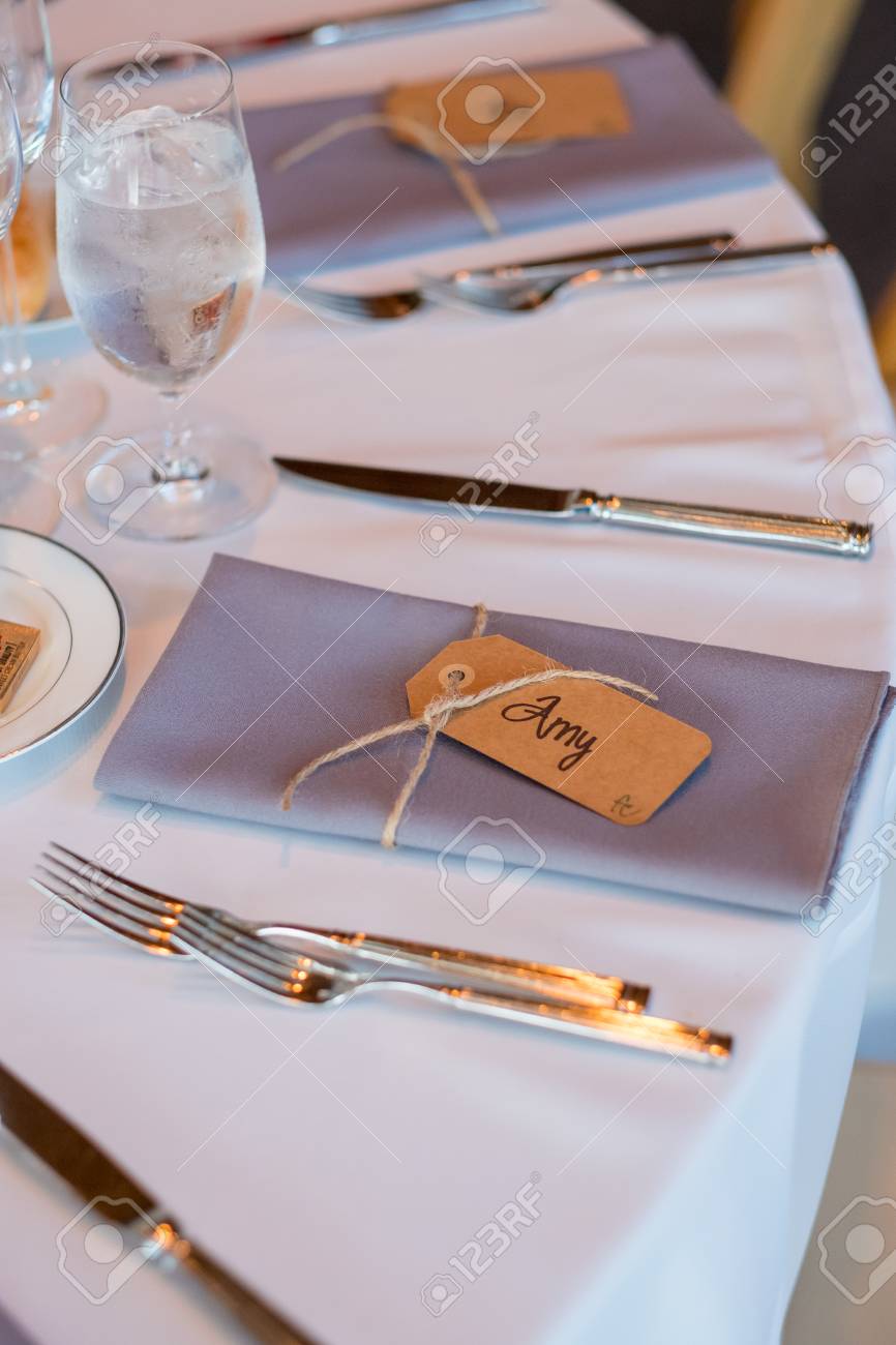folded napkins with name tags at reception stock photo picture and
