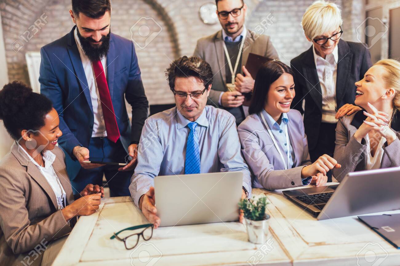 Group of business people working in office and discussing new ideas - 138588671 Group of business people working in office and discussing new ideas - 138588671