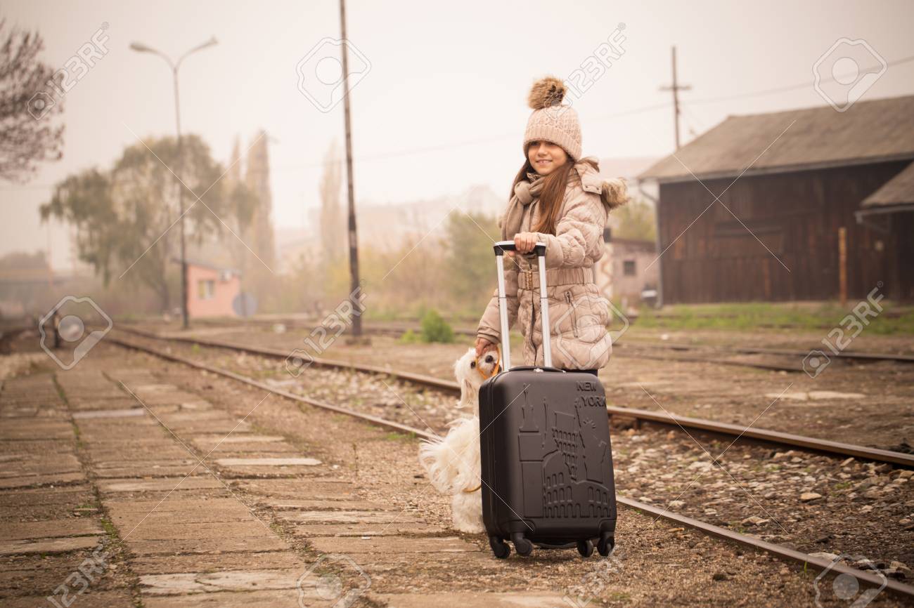 little girl with suitcase