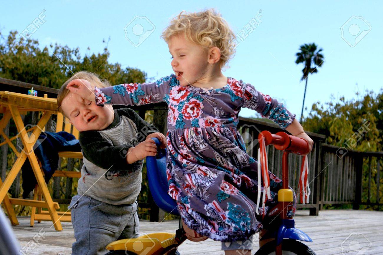 Cute little boy and his sister playing a little rougher than usual - 4723075 Cute little boy and his sister playing a little rougher than usual - 4723075