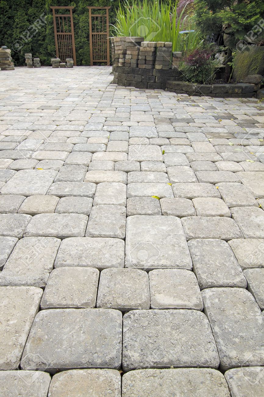 Laying Garden Cement Pavers Patio For Backyard Hardscape Landscaping Laying Garden Cement Pavers Patio for Backyard Hardscape Landscaping with Pond Stock Photo - 14192676 - Laying Garden Cement Pavers Patio For Backyard Hardscape Landscaping