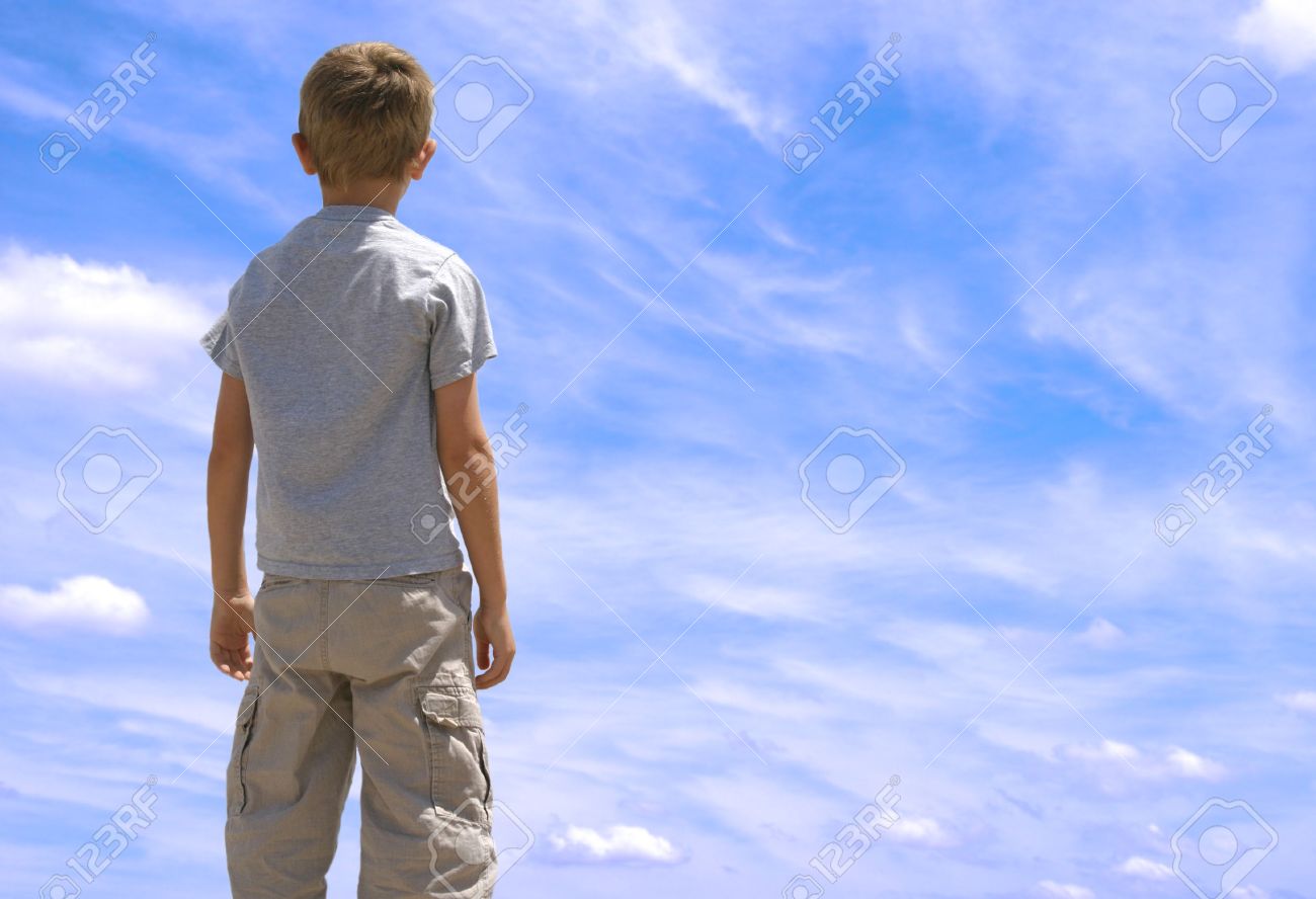 Young Boy Looking Up Twoards Blue Sky With Clouds. Stock Photo, Picture and  Royalty Free Image. Image 667587., image size:1300x888