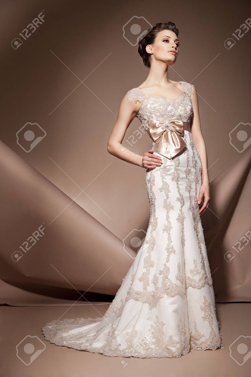The beautiful young woman posing in a wedding dress - 17850543 The beautiful young woman posing in a wedding dress - 17850543