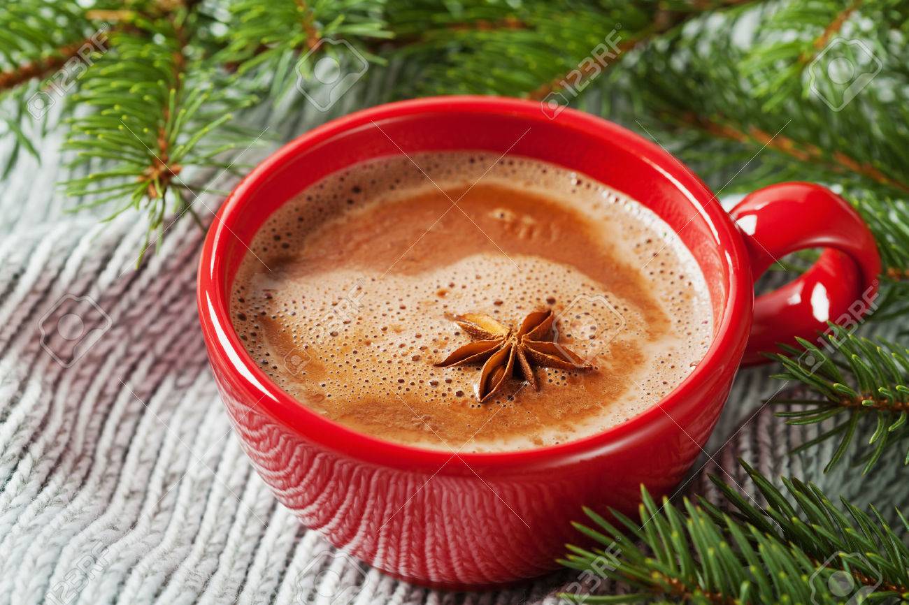 Cup of hot cocoa or hot chocolate on knitted background with fir tree, traditional beverage for winter time - 47924235 Cup of hot cocoa or hot chocolate on knitted background with fir tree, traditional beverage for winter time - 47924235