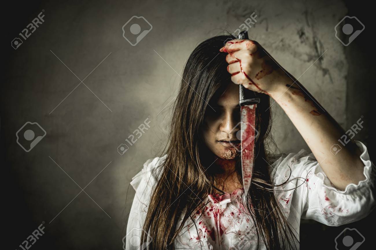 Asian girl dress killer to Halloween festival She's holding a kitchen knife and a big soaked with blood with terrible eyes ready to kill people. - 88039284 Asian girl dress killer to Halloween festival She's holding a kitchen knife and a big soaked with blood with terrible eyes ready to kill people. - 88039284