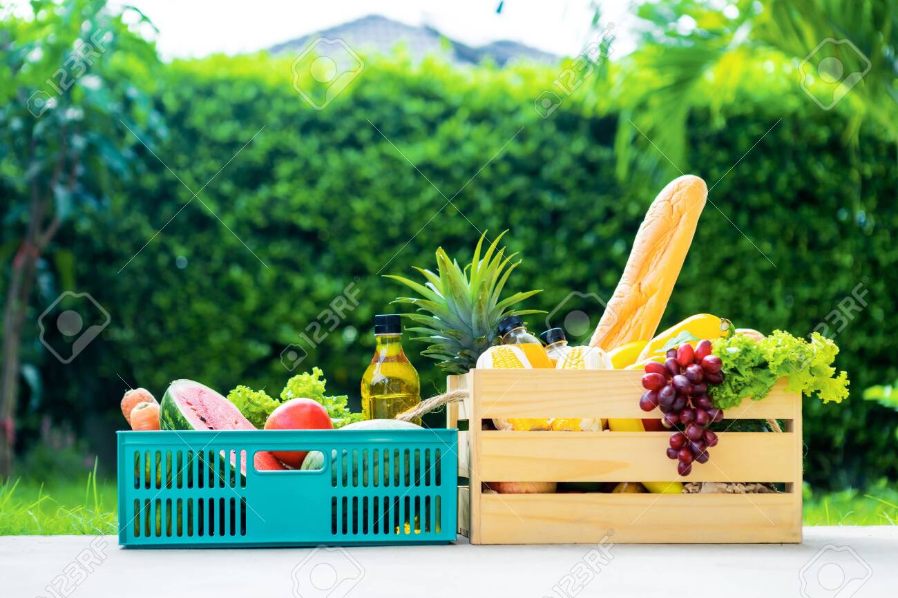 Wooden basket with vegetables. fresh vegetables in a basket. picnic in the garden. Stay at home. Enjoy cooking at home. Family concept. - 149143731 Wooden basket with vegetables. fresh vegetables in a basket. picnic in the garden. Stay at home. Enjoy cooking at home. Family concept. - 149143731