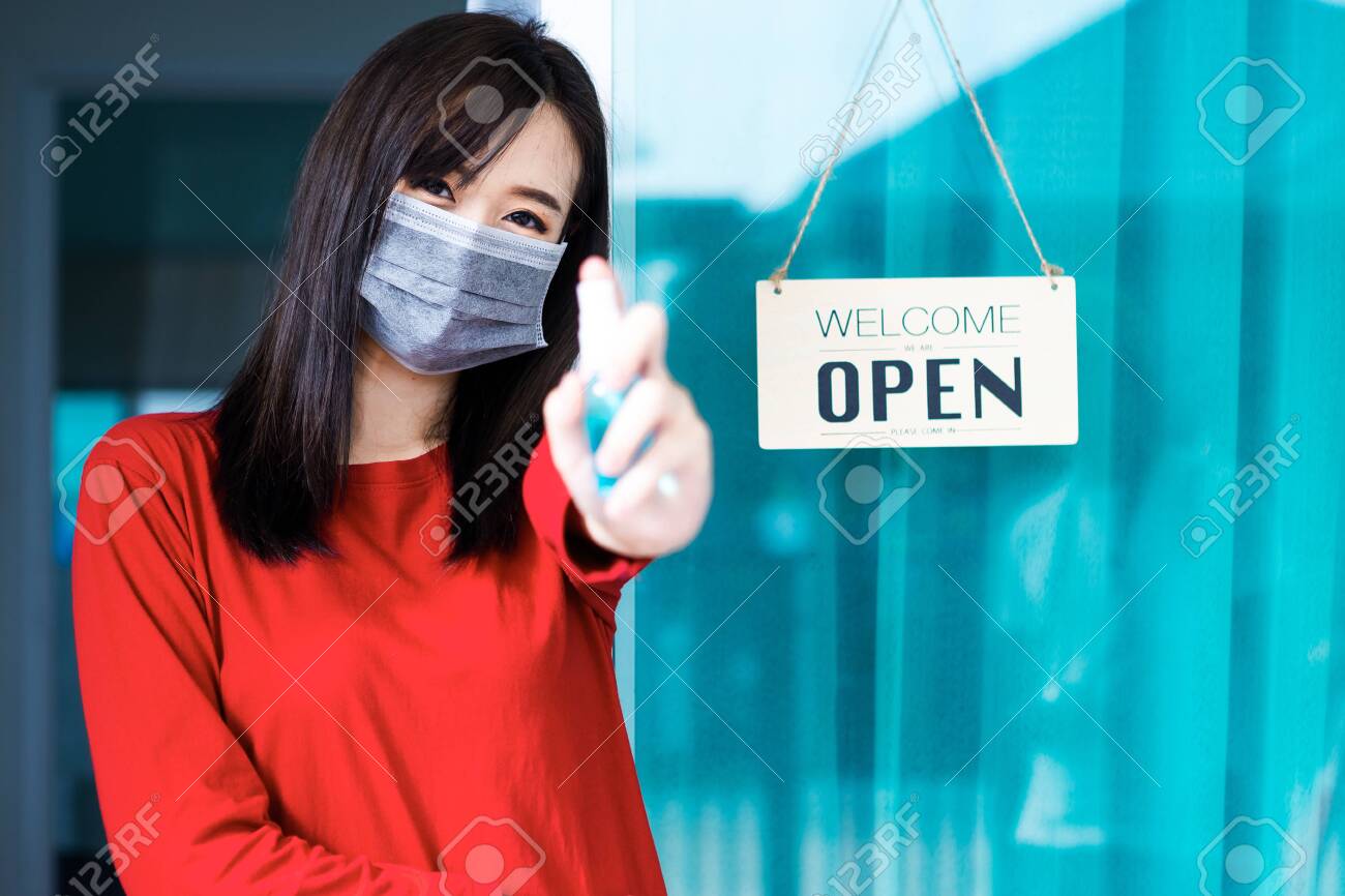 Smiling Asian muslim woman with using mobile or smartphone exciting over isolated color background. - 151862896 Smiling Asian muslim woman with using mobile or smartphone exciting over isolated color background. - 151862896
