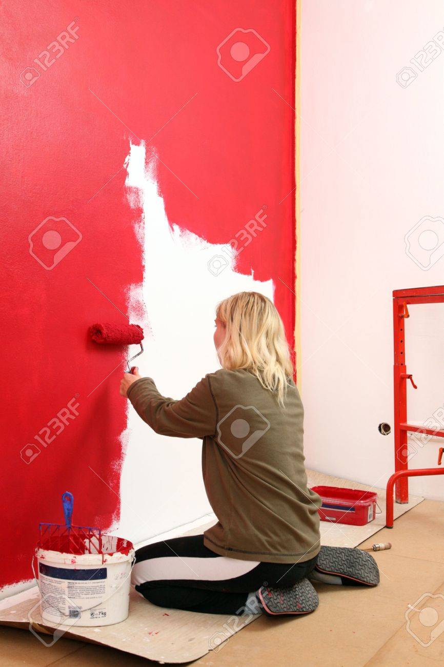 Girl Painting Living Room In A Red Color Stock Photo Picture And