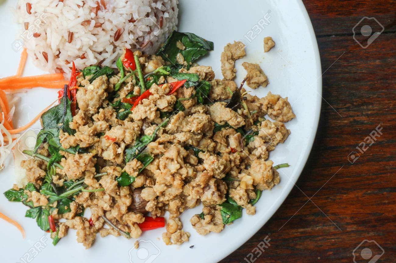 Rice And Stir Fried Pork Holy Basil (Thai Food) - Close Up Of Rice Topped  With Stir Fried Minced Pork And Holy Basil Stock Photo, Picture And Royalty  Free Image. Image 61707368.