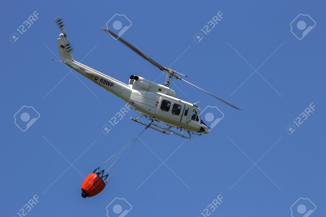 AHLEN, GERMANY - JUN 5, 2016: Bell 212 Huey Helicopter With A Bambi Bucket  For Fire Fighting Stock Photo, Picture and Royalty Free Image. Image  67802345.