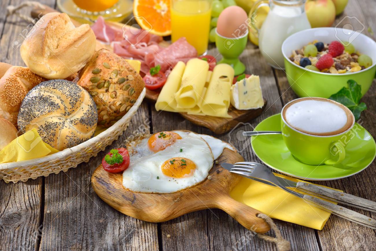 Outside served luxuriant breakfast with fried eggs a wide selection of other foods - 61877631 Outside served luxuriant breakfast with fried eggs a wide selection of other foods - 61877631