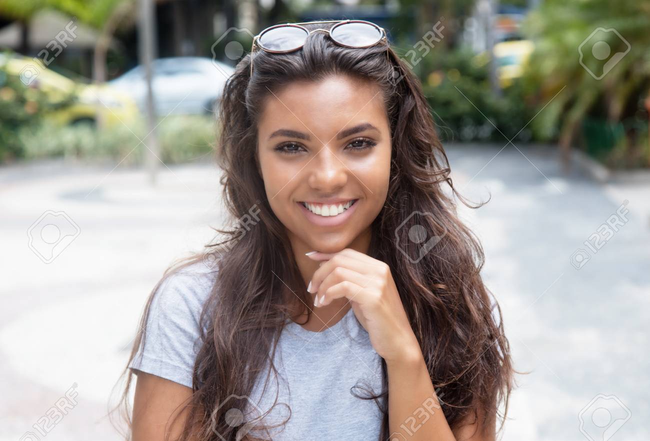 https://previews.123rf.com/images/kadettmann/kadettmann1705/kadettmann170500023/78087020-portrait-of-a-beautiful-latin-american-woman-in-the-city-in-the-summer.jpg