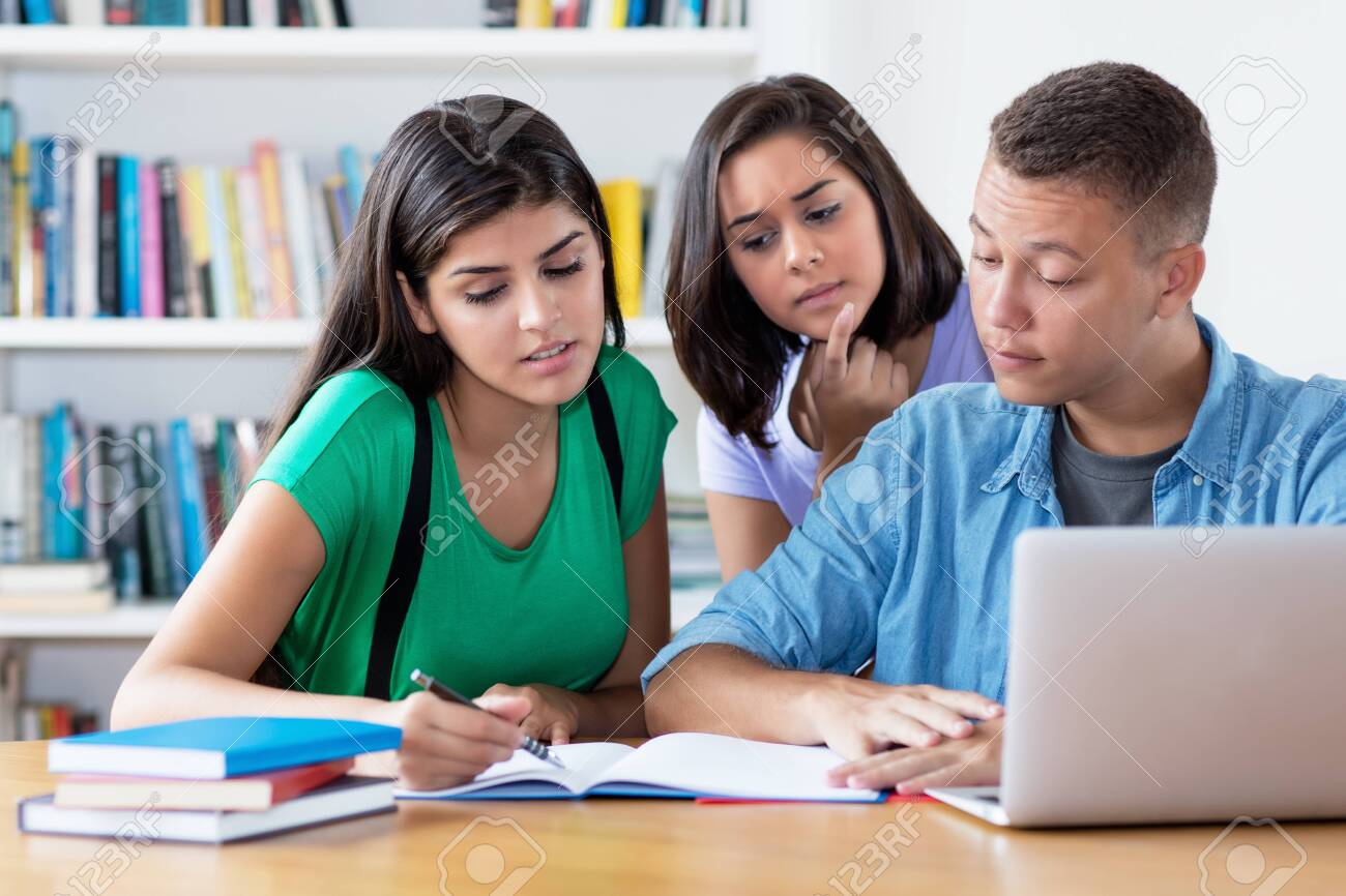 Group of american and latin students learing coding - 143687685 Group of american and latin students learing coding - 143687685