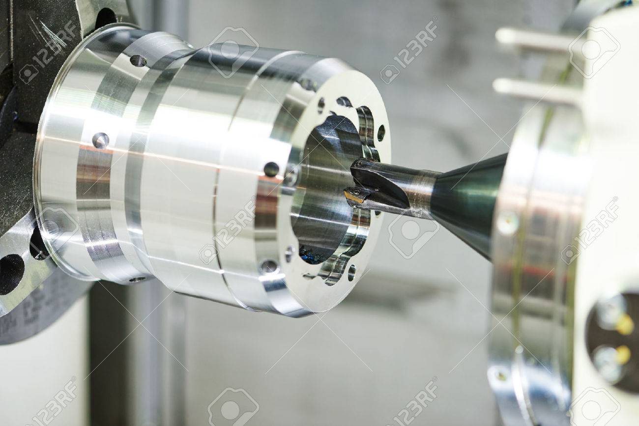 metalwork industry. multi cutting tool cnc machine pefroming technology counterboring and drilling metal detail on lathe at factory. Toned - 65192969 metalwork industry. multi cutting tool cnc machine pefroming technology counterboring and drilling metal detail on lathe at factory. Toned - 65192969