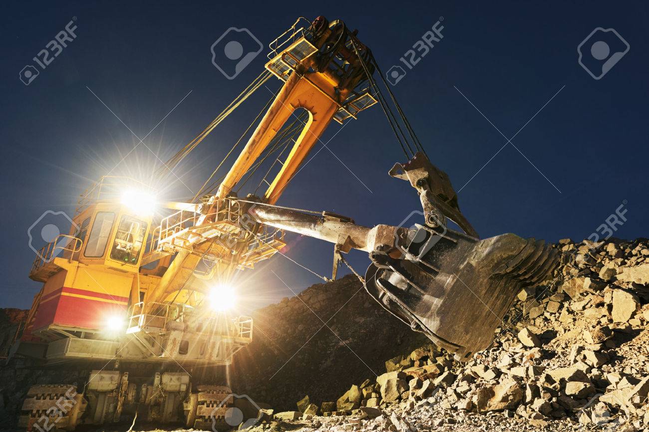 Mining construction industry. Excavator digging granite or ore in quarry - 77656317 Mining construction industry. Excavator digging granite or ore in quarry - 77656317