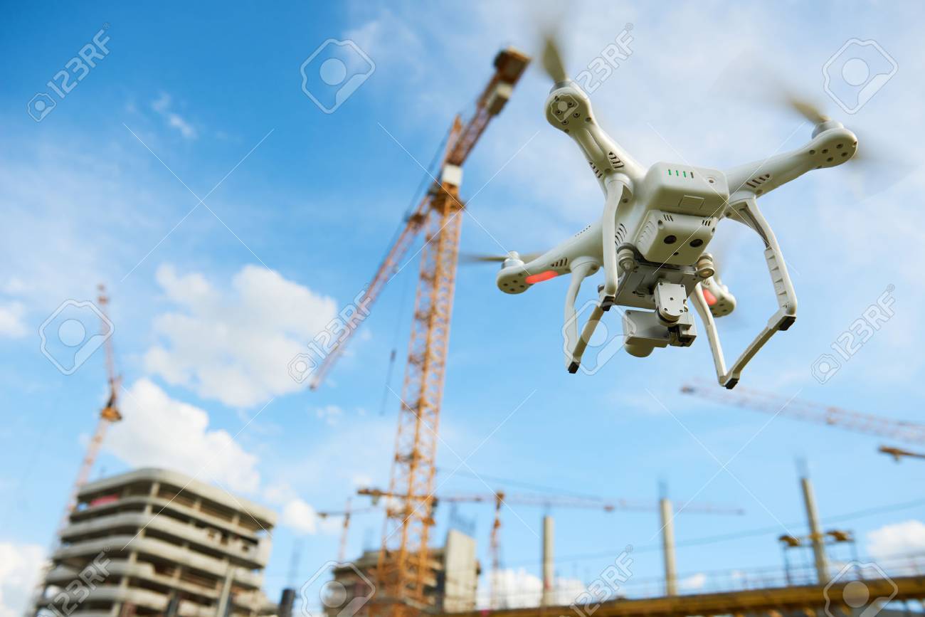 Drone over construction site. video surveillance or industrial inspection - 84484241 Drone over construction site. video surveillance or industrial inspection - 84484241