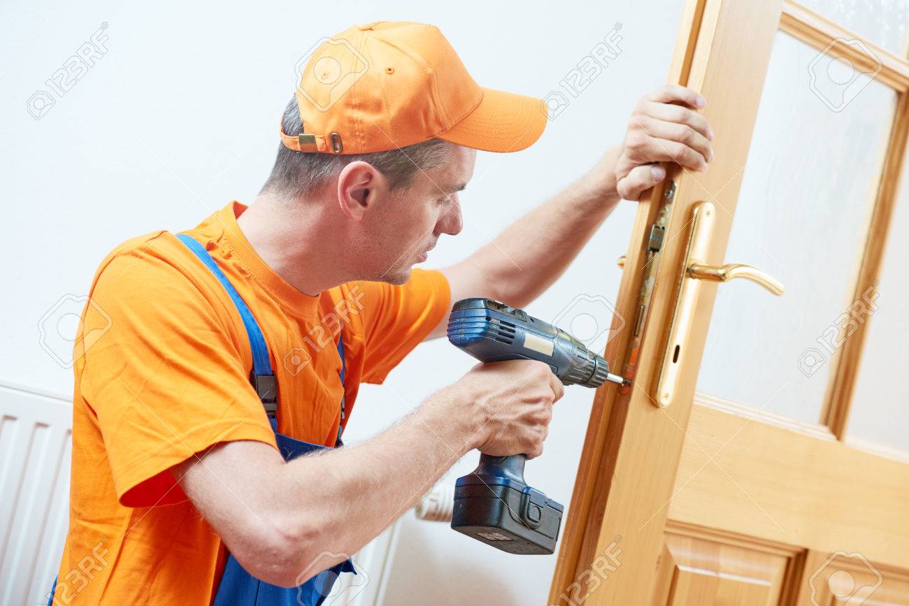 carpenter at door lock installation or repair - 83804436 carpenter at door lock installation or repair - 83804436
