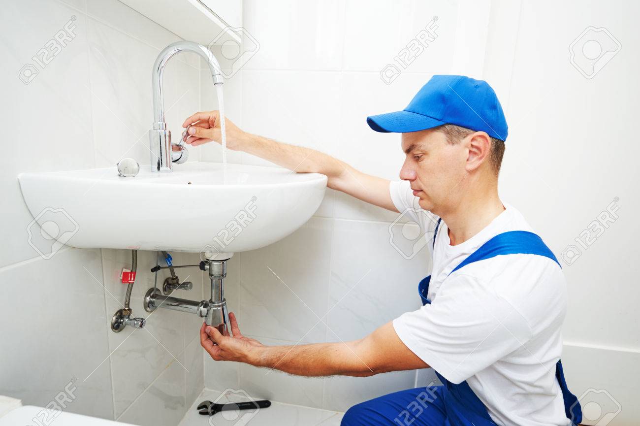plumber man repair leaky faucet tap - 83807819 plumber man repair leaky faucet tap - 83807819