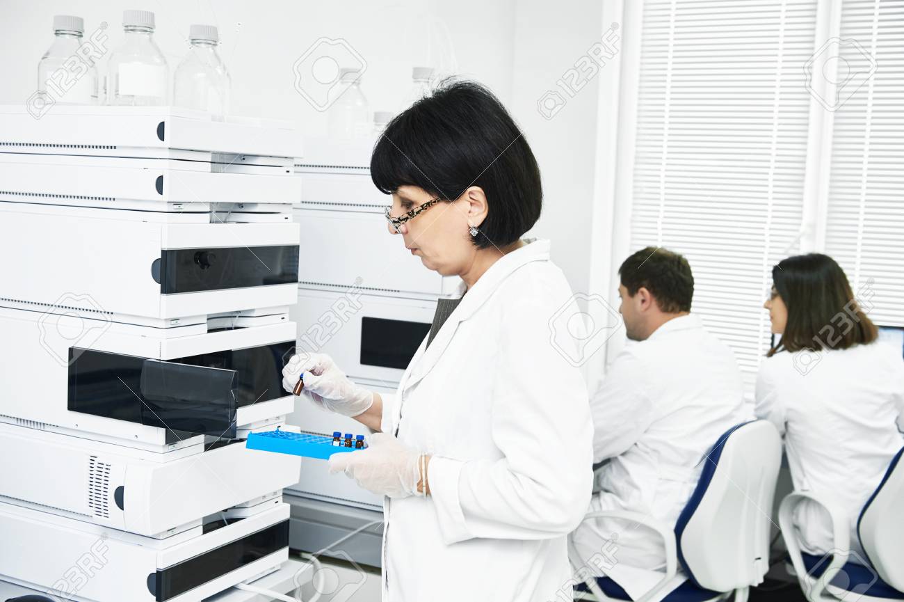 chromatography. Researcher putting flask in equipment - 88126734 chromatography. Researcher putting flask in equipment - 88126734