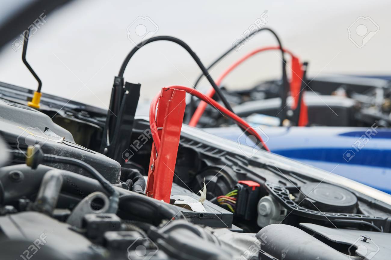 Automobile help. booster jumper cables charging automobile discharged battery - 103848150 Automobile help. booster jumper cables charging automobile discharged battery - 103848150