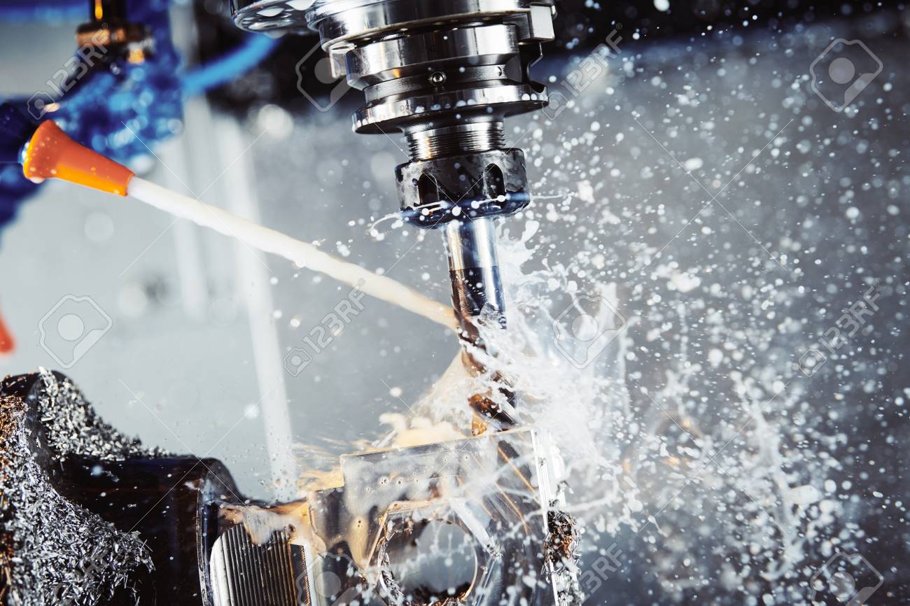 Milling metalworking process. Industrial CNC metal machining by vertical mill. Coolant and lubrication - 103905931 Milling metalworking process. Industrial CNC metal machining by vertical mill. Coolant and lubrication - 103905931