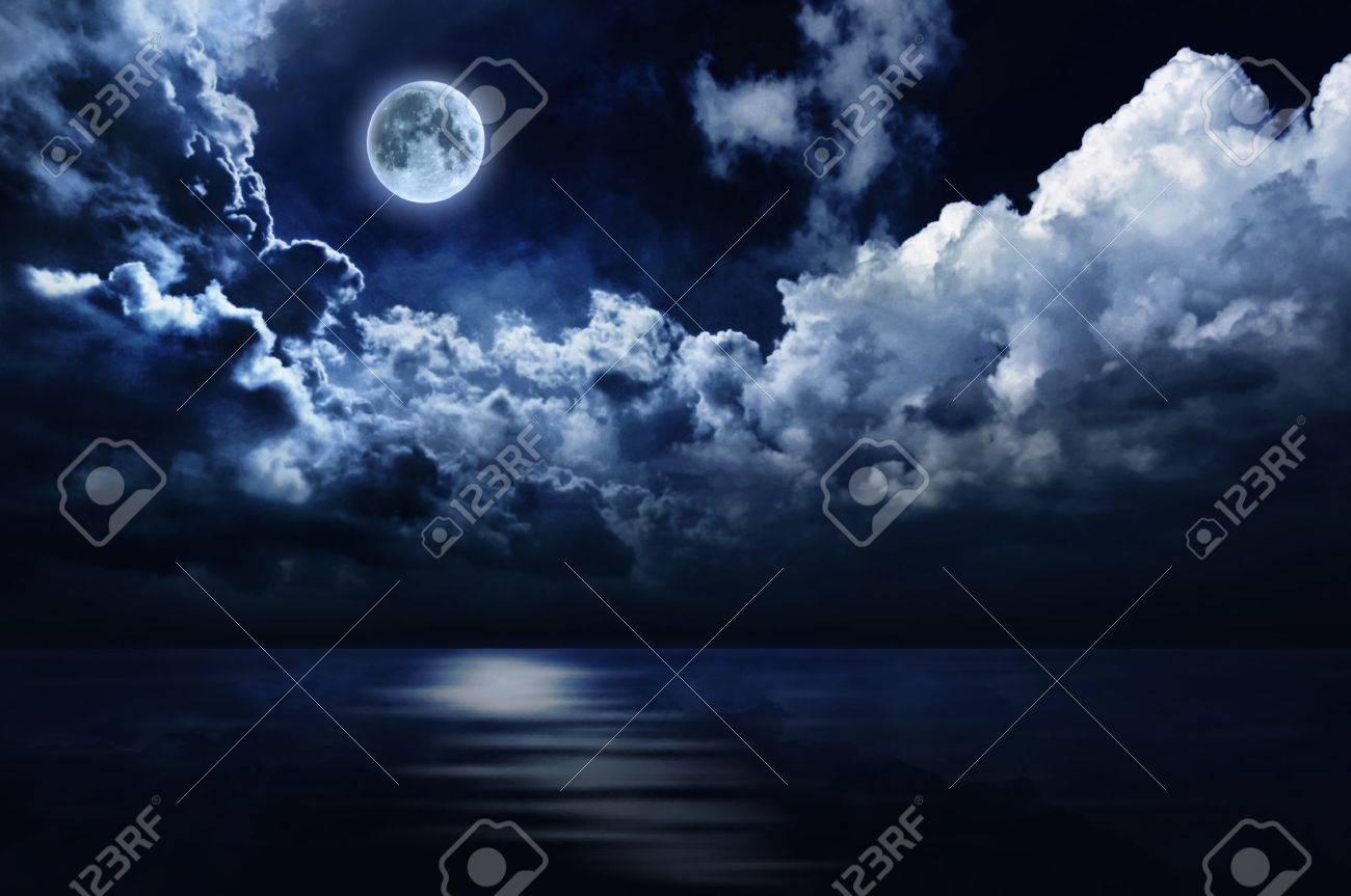 Full Moon In Night Sky Over Water Stock Photo, Picture And Royalty Free  Image. Image 12460314.