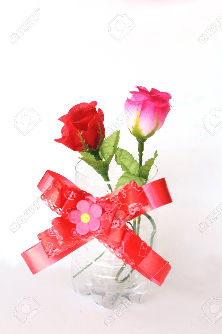 Red And Pink Artificial Rose In The Plastic Vase Made From
