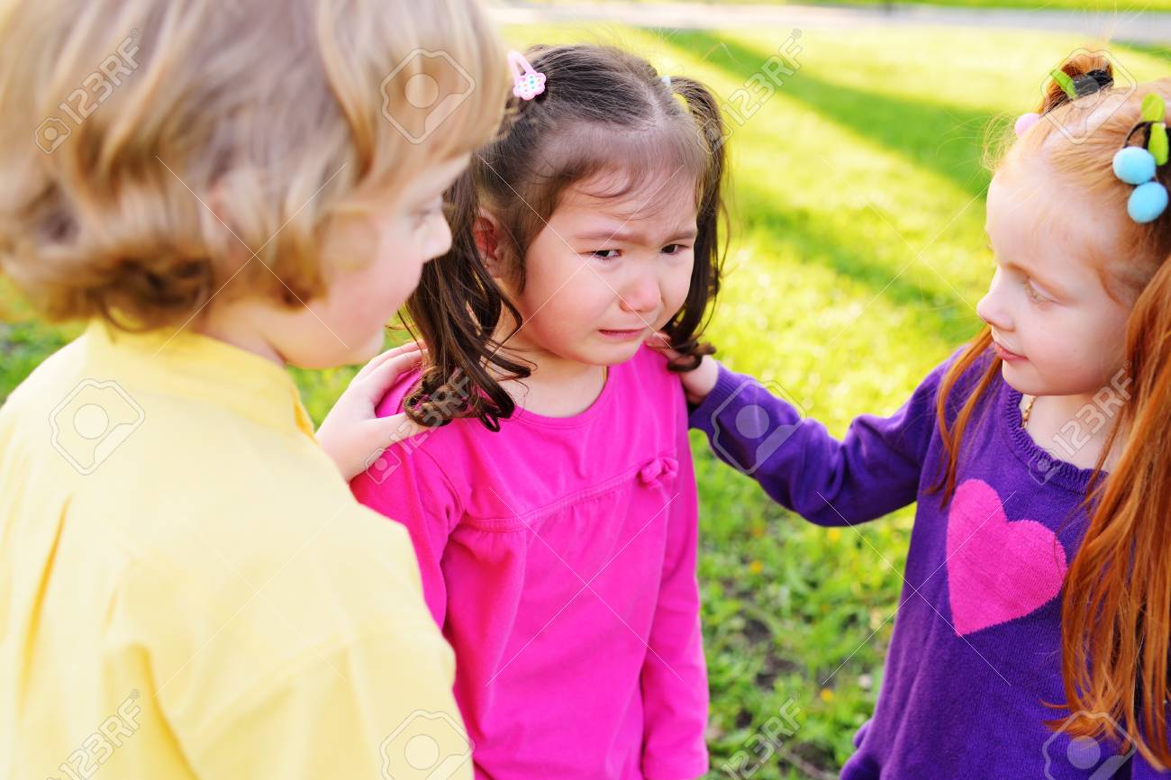 children feel sorry for a weeping little girl. Childhood, friends, crying, friendship, pity, feelings compassion - 101417241 children feel sorry for a weeping little girl. Childhood, friends, crying, friendship, pity, feelings compassion - 101417241