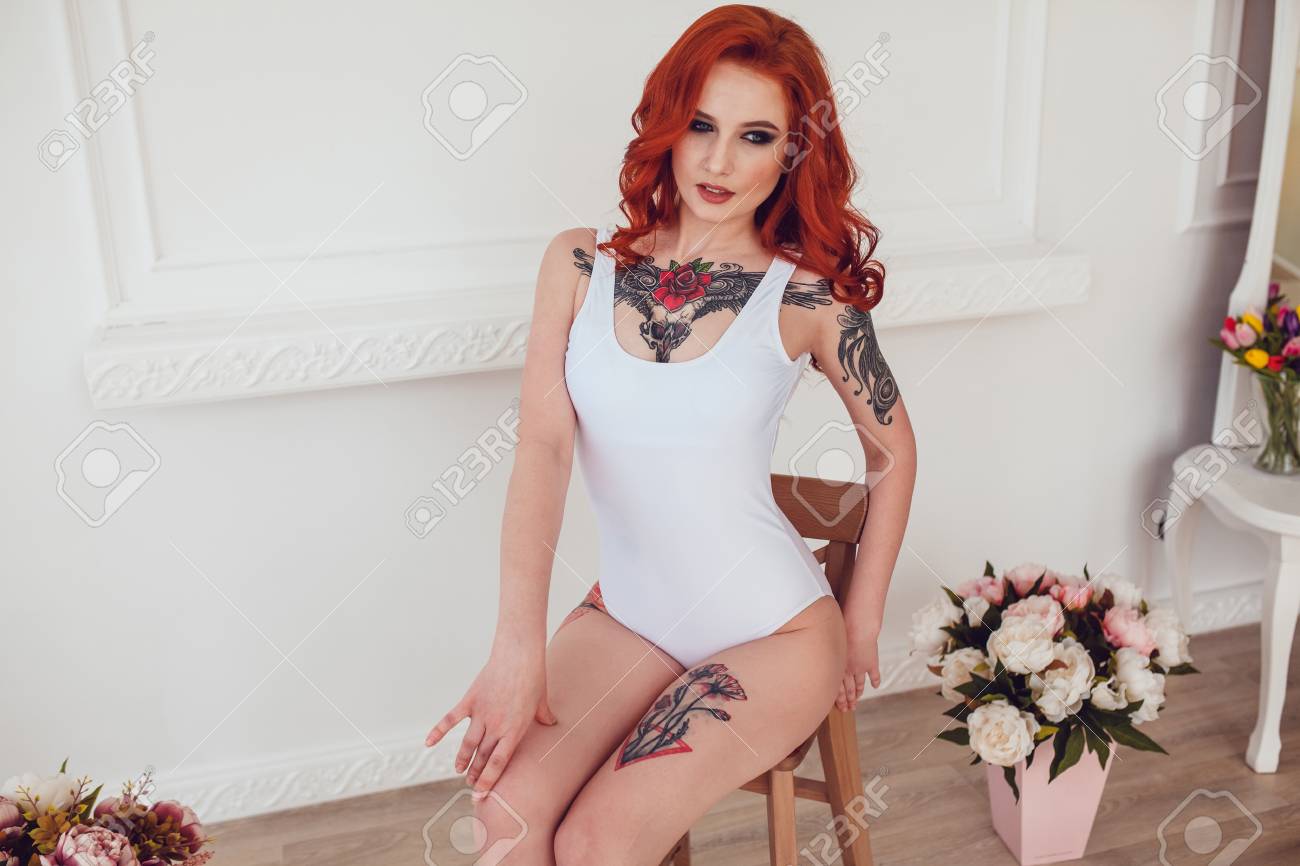 Beautiful Sexy Girl With Red Hair And Tattoo Sitting On A Chair Stock Photo Picture And Royalty Free Image Image Beautiful Sexy Girl With Red Hair And Tattoo Sitting On A Chair Stock Photo Picture And Royalty Free Image Image