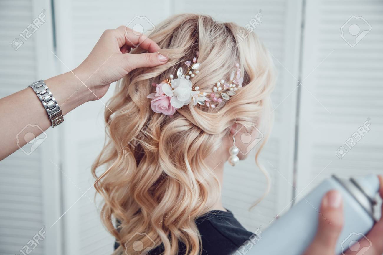 Hair Stylist Fixes The Styling With A Hair Spray Hairdresser At Work