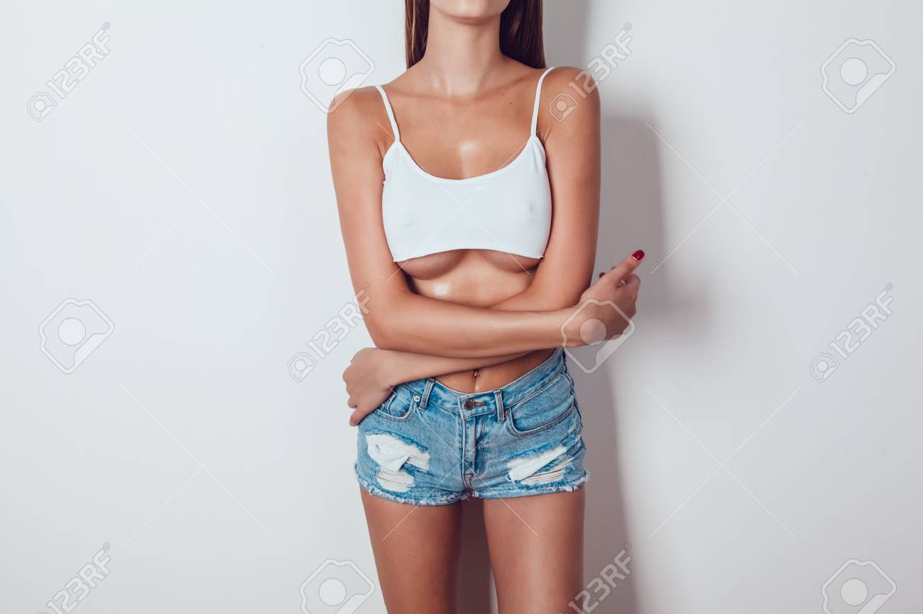 Body Of A Girl With Big Breasts With Big Breasts In A Very Short White Tank  Top. Stock Photo, Picture and Royalty Free Image. Image 86202533., image size:1300x866
