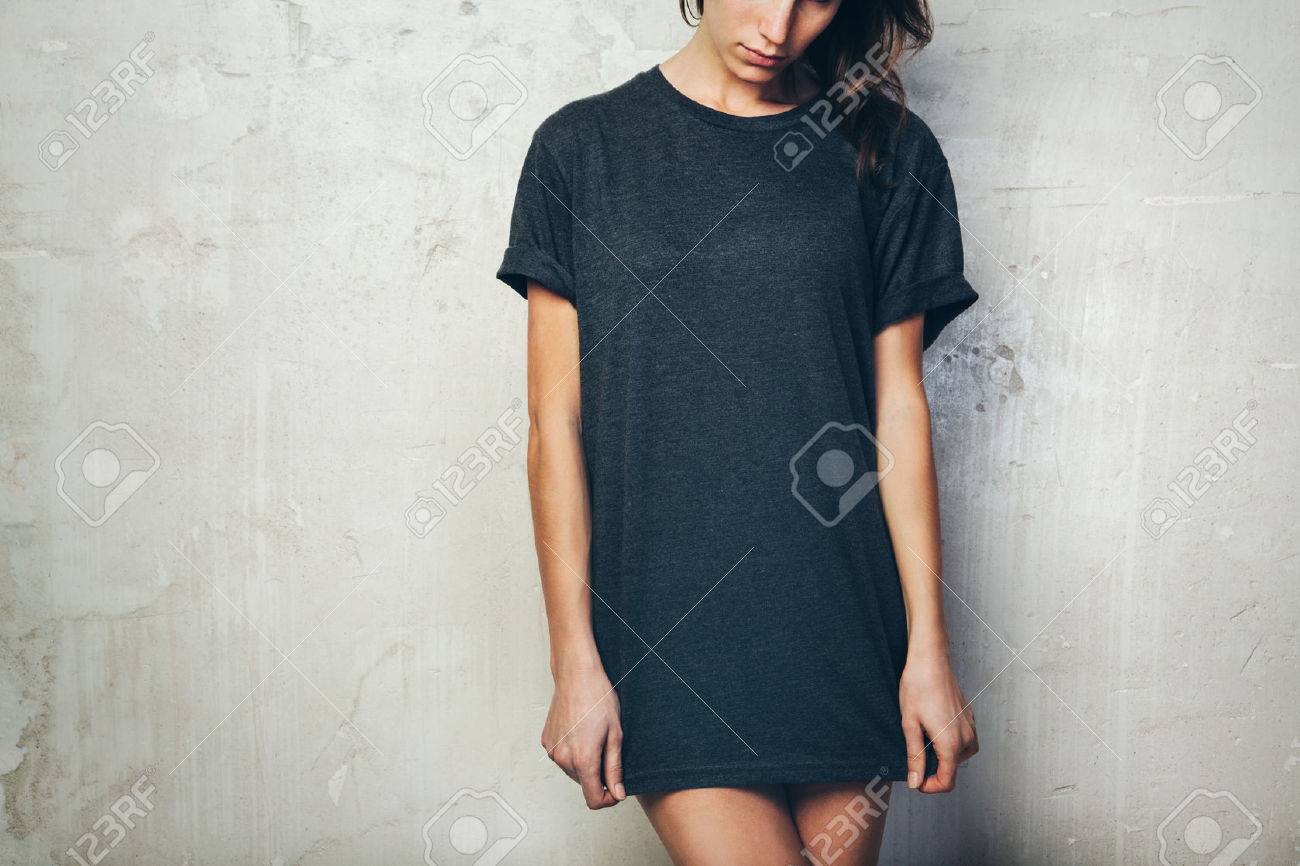Young girl wearing blank black t-shirt. Concrete wall background - 52905725 Young girl wearing blank black t-shirt. Concrete wall background - 52905725