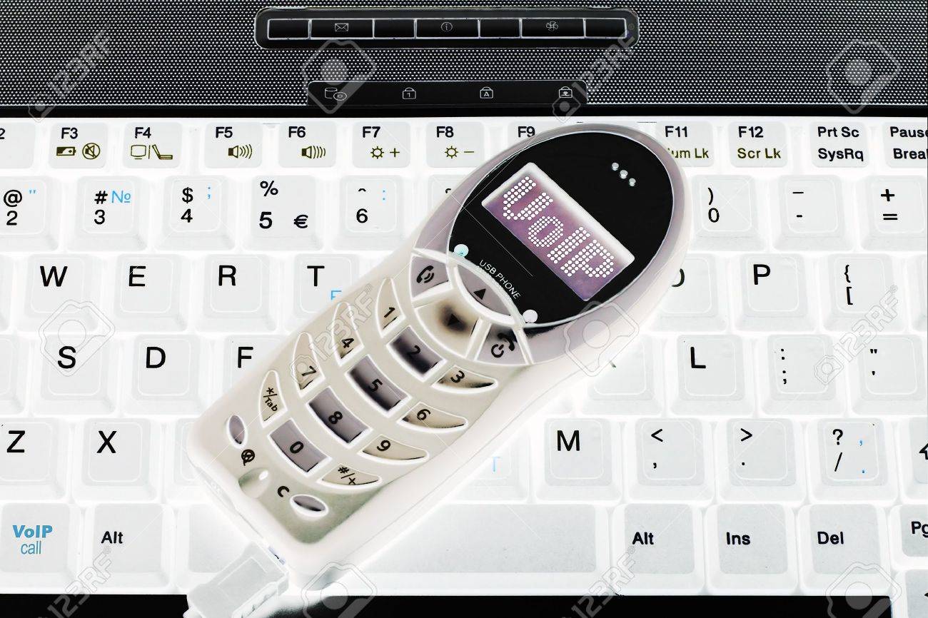 shot of the voip usb phone connected with laptop - 819901 shot of the voip usb phone connected with laptop - 819901