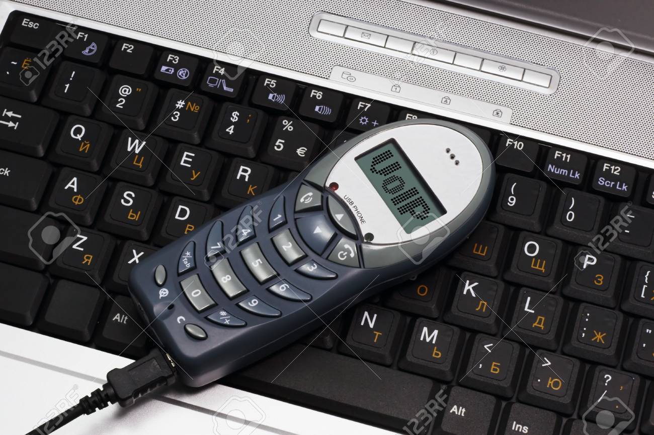 shot of the voip usb phone connected with laptop - 819907 shot of the voip usb phone connected with laptop - 819907